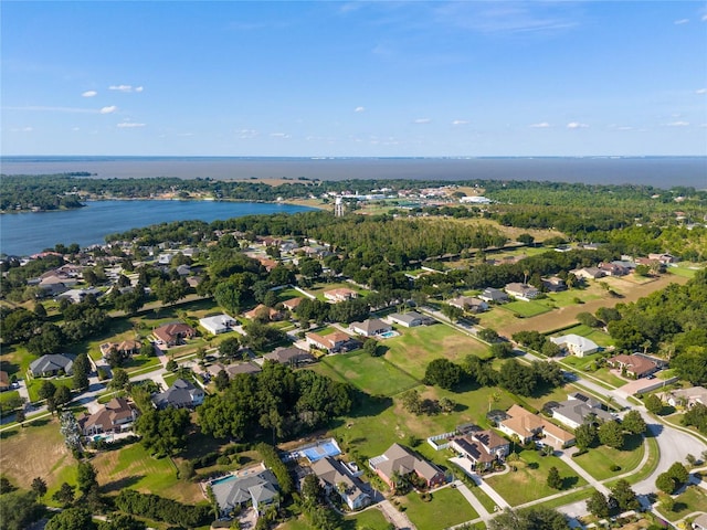 bird's eye view featuring a water view and a residential view