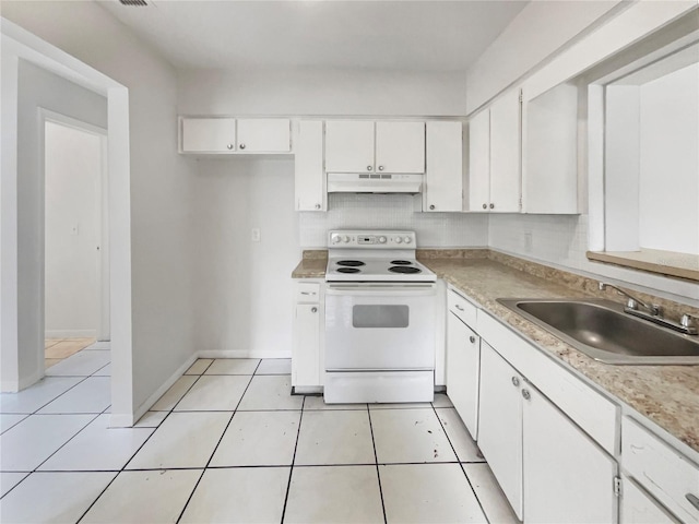 kitchen featuring light tile patterned floors, electric range, white cabinets, under cabinet range hood, and a sink