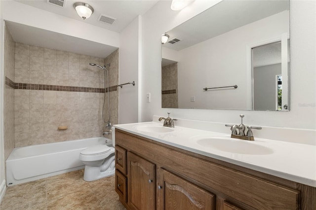 full bathroom with toilet, visible vents, shower / washtub combination, and a sink