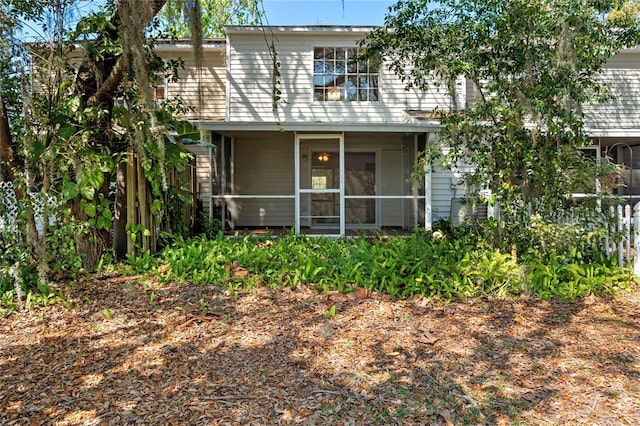 view of front of house featuring a sunroom