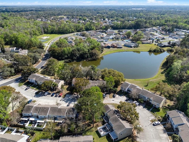 bird's eye view with a water view, a residential view, and a view of trees