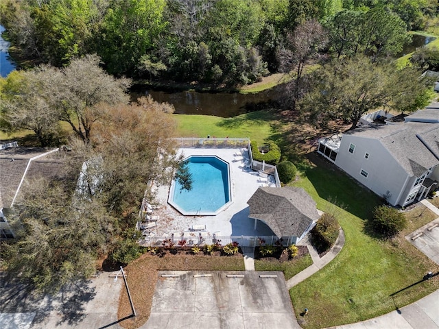 birds eye view of property with a water view