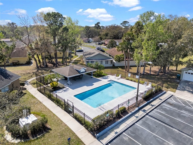 community pool featuring a patio area and fence