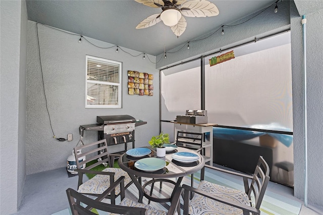 interior space featuring ceiling fan and area for grilling