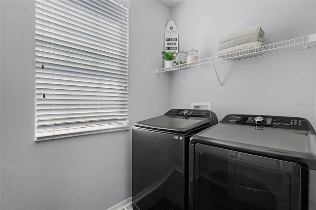 washroom with laundry area and independent washer and dryer