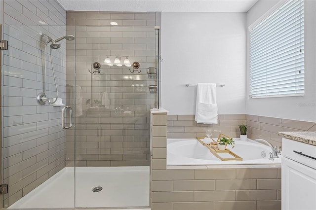 full bath with a stall shower, a bath, and a healthy amount of sunlight
