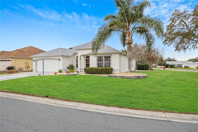 view of front of property with an attached garage, a shingled roof, concrete driveway, stucco siding, and a front yard