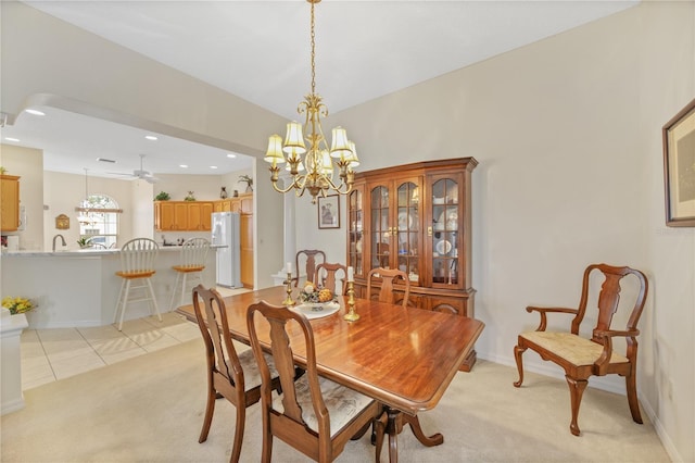 dining space with recessed lighting, light colored carpet, baseboards, and light tile patterned floors