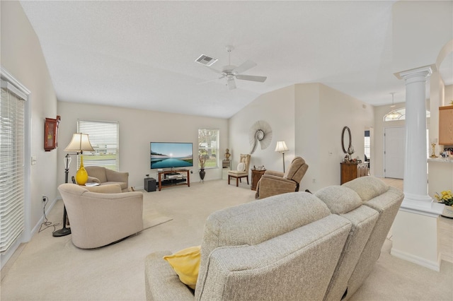 living area featuring a ceiling fan, light colored carpet, visible vents, and decorative columns