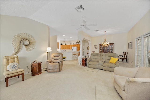 living room featuring light colored carpet and visible vents