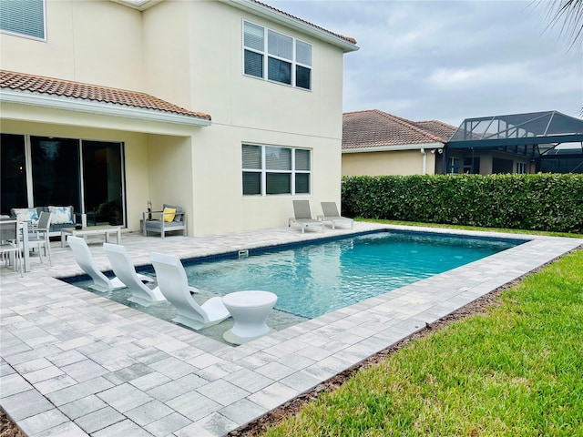 view of swimming pool with a fenced in pool and a patio area