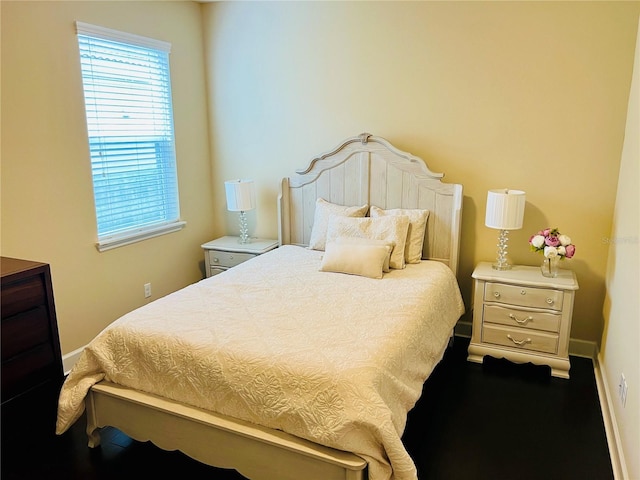 bedroom featuring baseboards