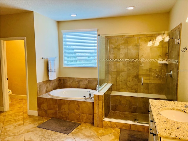 full bathroom with toilet, a stall shower, vanity, tile patterned flooring, and a bath