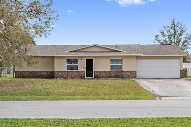 ranch-style house with an attached garage, a front yard, fence, and stucco siding