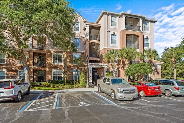 1357 Venezia Ct Unit 402, Davenport, FL 33896 - view of building exterior with uncovered parking