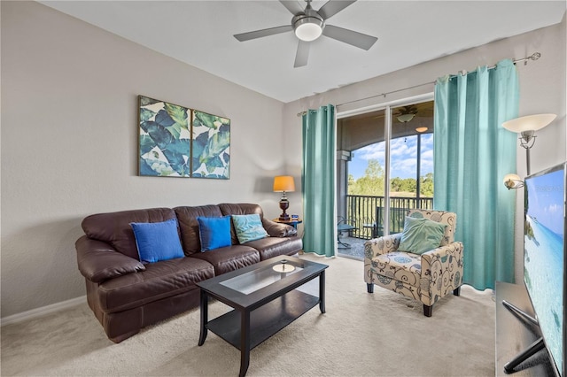 1357 Venezia Ct Unit 402, Davenport, FL 33896 - living room featuring baseboards, a ceiling fan, and light colored carpet