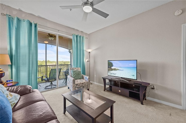 1357 Venezia Ct Unit 402, Davenport, FL 33896 - living area featuring light carpet, baseboards, and a ceiling fan