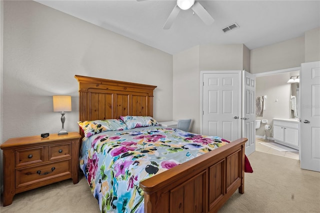 1357 Venezia Ct Unit 402, Davenport, FL 33896 - bedroom with a ceiling fan, visible vents, light carpet, and ensuite bath