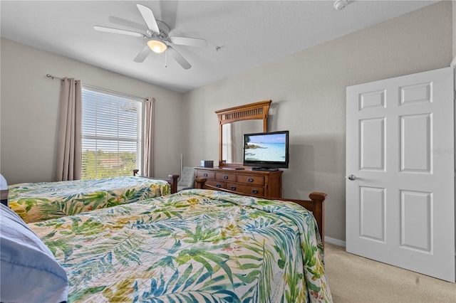 1357 Venezia Ct Unit 402, Davenport, FL 33896 - bedroom with ceiling fan, baseboards, and light colored carpet