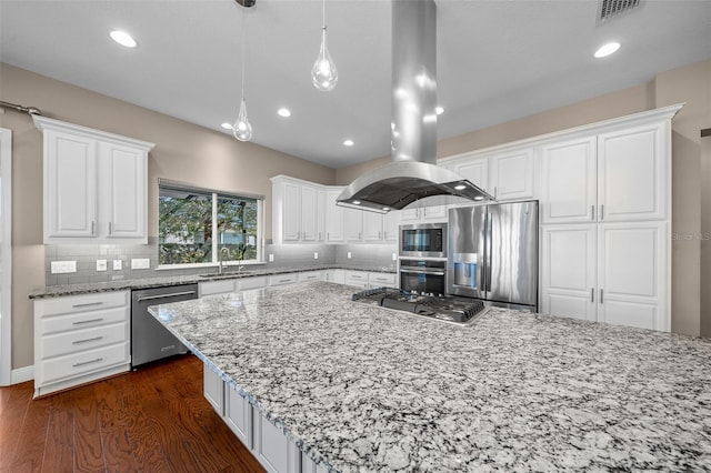 kitchen with light stone counters, dark wood finished floors, island exhaust hood, stainless steel appliances, and decorative backsplash