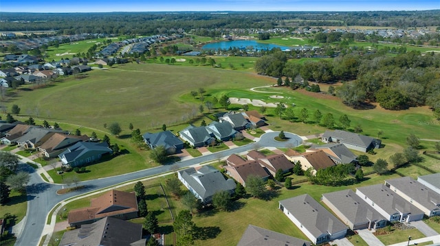 aerial view with a water view, view of golf course, and a residential view