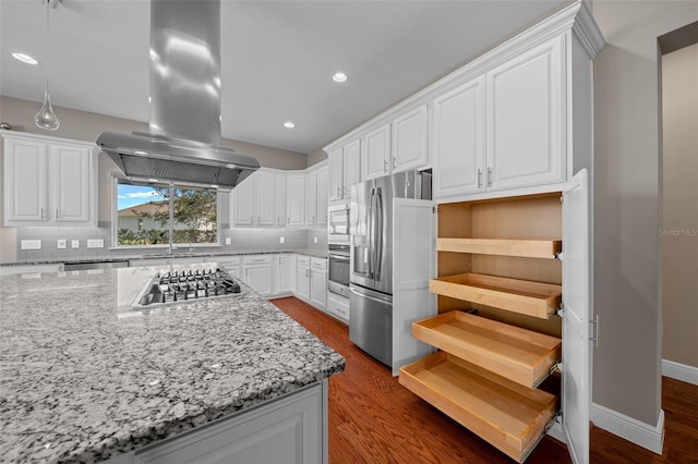 kitchen featuring appliances with stainless steel finishes, island range hood, decorative backsplash, and dark wood-type flooring