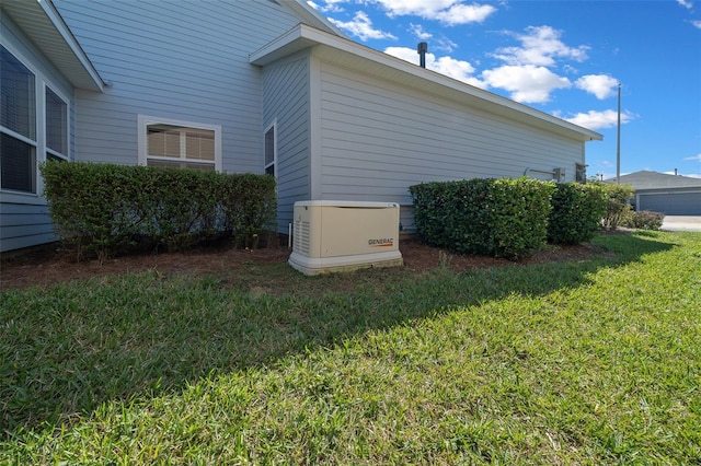 view of side of home featuring a lawn