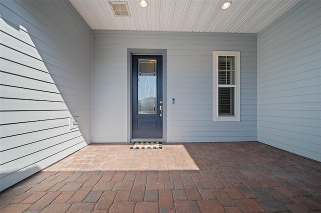 doorway to property with a patio