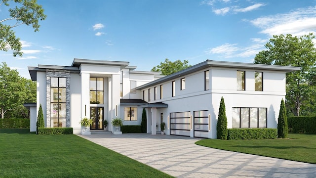 view of front of property with a front lawn, decorative driveway, an attached garage, and stucco siding