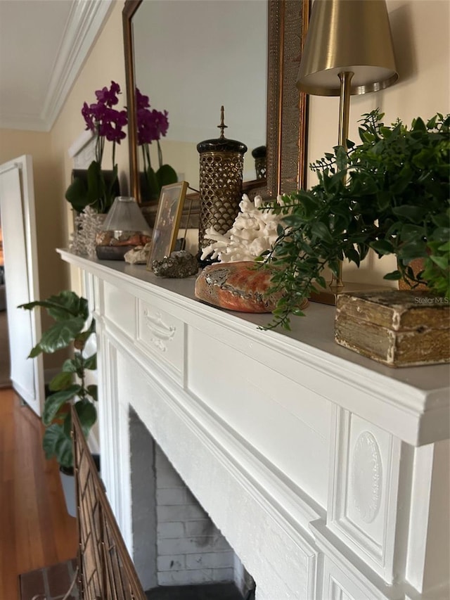 interior details with crown molding and wood finished floors