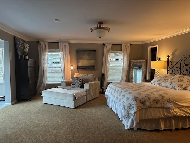 carpeted bedroom with ornamental molding and baseboards