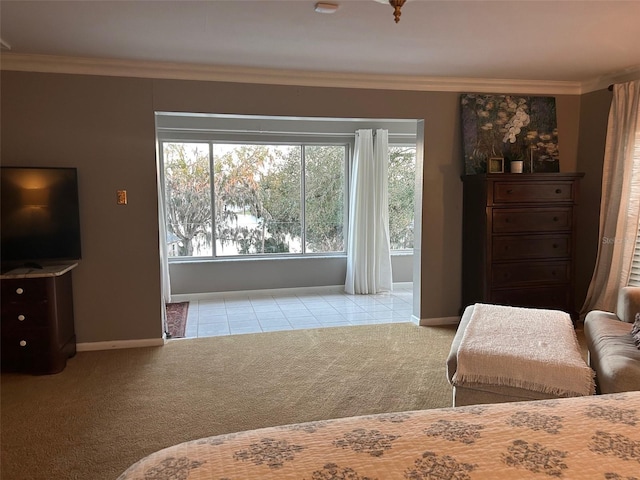 bedroom featuring baseboards, crown molding, and light colored carpet