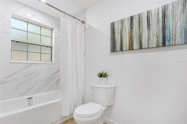 bathroom with toilet and shower / tub combo with curtain