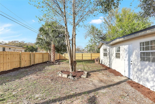 view of yard with a fenced backyard