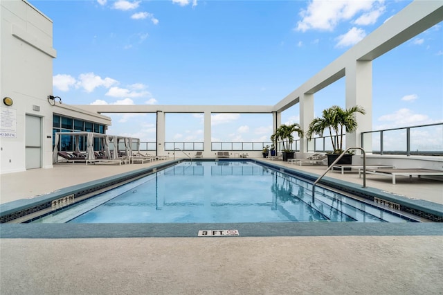 community pool with a patio area