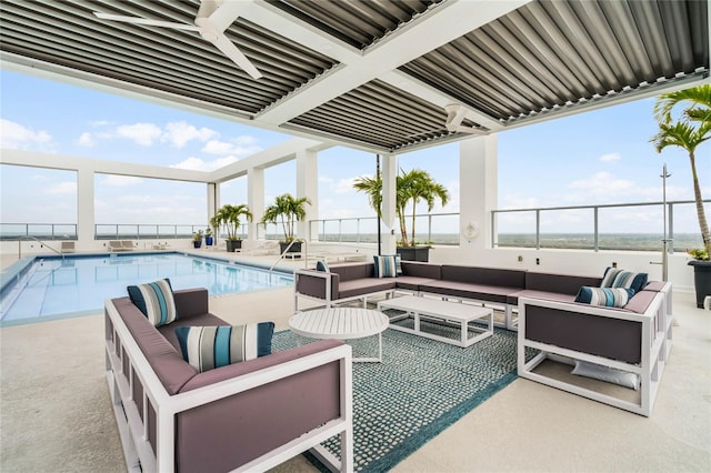 view of patio featuring a community pool and an outdoor hangout area