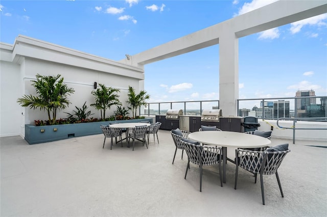 view of patio with grilling area and outdoor dining space