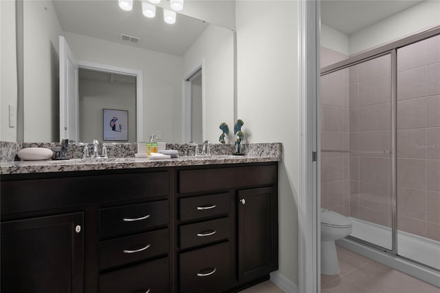 full bathroom featuring tile patterned flooring, toilet, visible vents, a shower stall, and double vanity