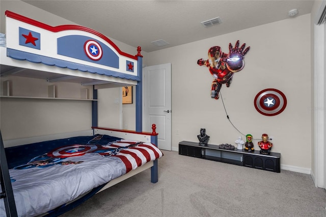 bedroom with baseboards, visible vents, a textured ceiling, and carpet flooring