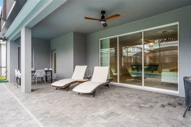 view of patio with a ceiling fan and outdoor dining space