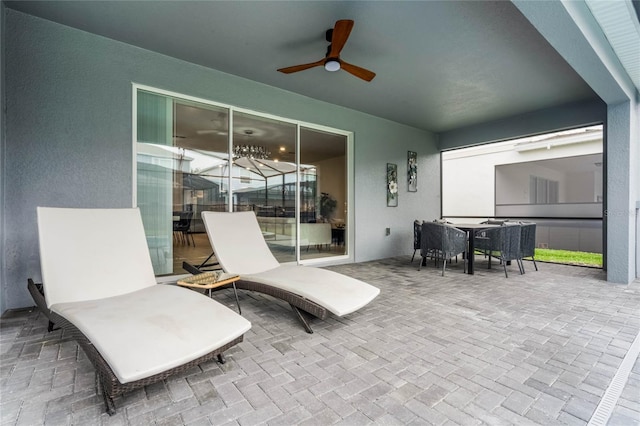 view of patio / terrace featuring a ceiling fan and outdoor dining space