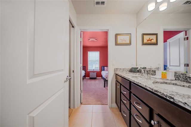 4149 Lana Ave, Davenport, FL 33897 - ensuite bathroom with double vanity and tile patterned flooring