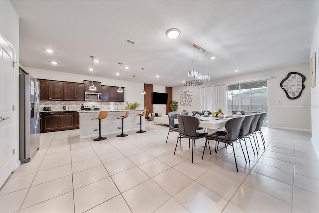 4149 Lana Ave, Davenport, FL 33897 - dining room featuring a chandelier, recessed lighting, and light tile patterned floors