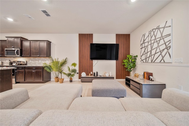 4149 Lana Ave, Davenport, FL 33897 - living room featuring light tile patterned flooring, baseboards, and recessed lighting