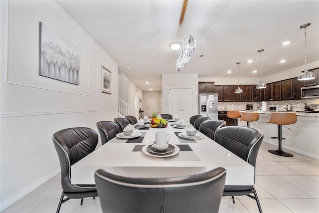 4149 Lana Ave, Davenport, FL 33897 - dining room with light tile patterned floors, recessed lighting, and baseboards
