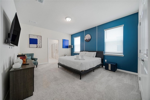 4149 Lana Ave, Davenport, FL 33897 - bedroom with carpet, baseboards, and ensuite bathroom