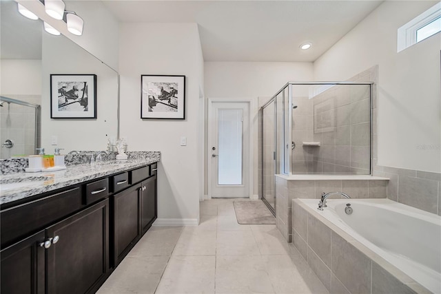 4149 Lana Ave, Davenport, FL 33897 - full bathroom with a shower stall, a bath, double vanity, and tile patterned floors