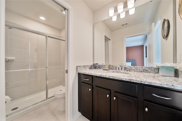 4149 Lana Ave, Davenport, FL 33897 - bathroom featuring toilet, a stall shower, vanity, and tile patterned floors