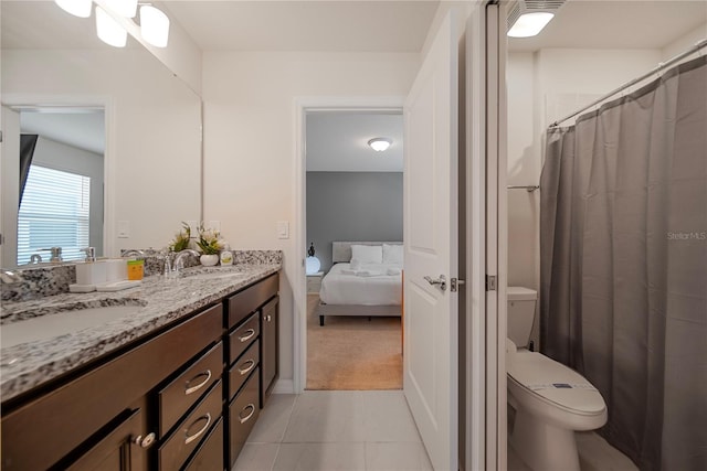 4149 Lana Ave, Davenport, FL 33897 - full bathroom with connected bathroom, double vanity, toilet, and tile patterned floors