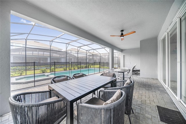 4149 Lana Ave, Davenport, FL 33897 - view of patio with outdoor dining space, a ceiling fan, and glass enclosure
